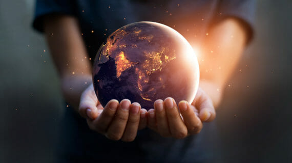 hands holding a globe